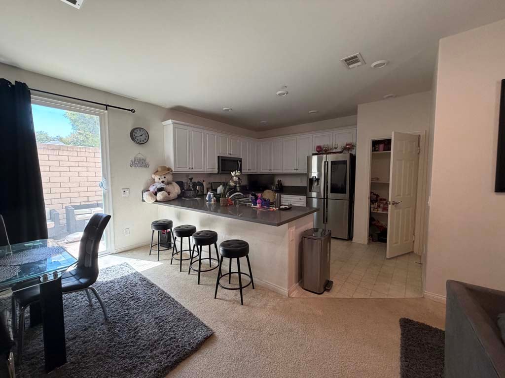 Dining table and chairs in abandoned property contents auction