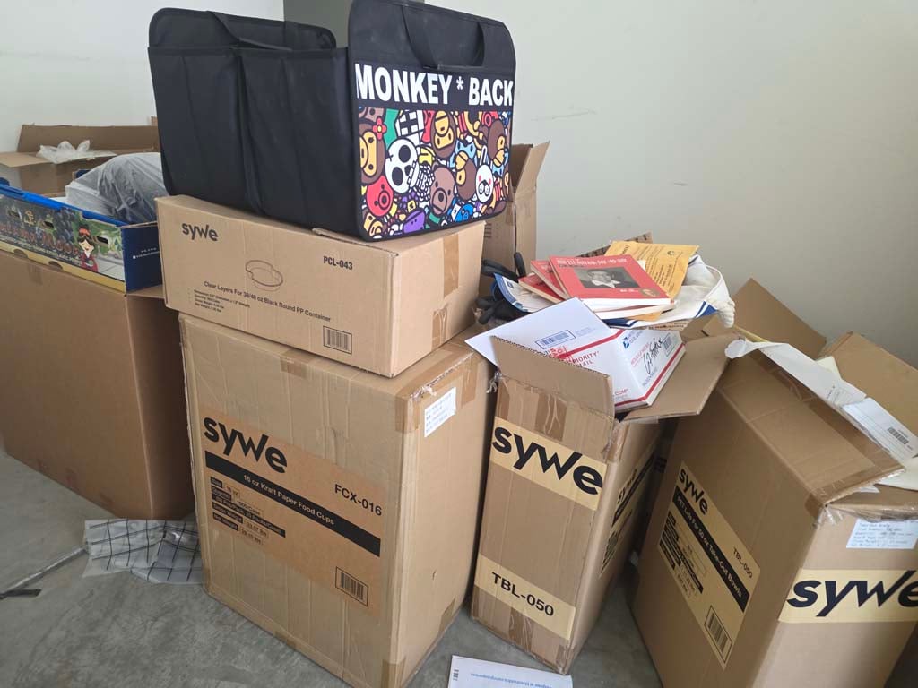 Boxes of take-out containers at Irvine CA liquidation auction