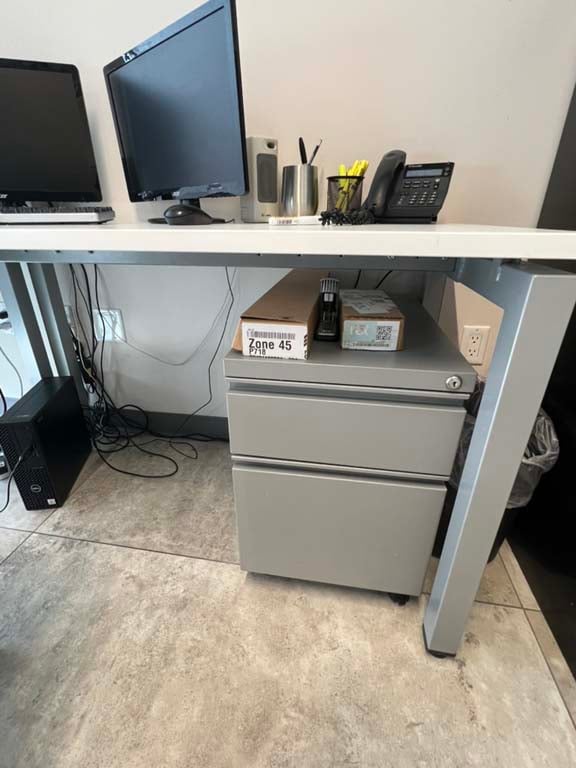 Landline phones and desktop organizers in office liquidation auction