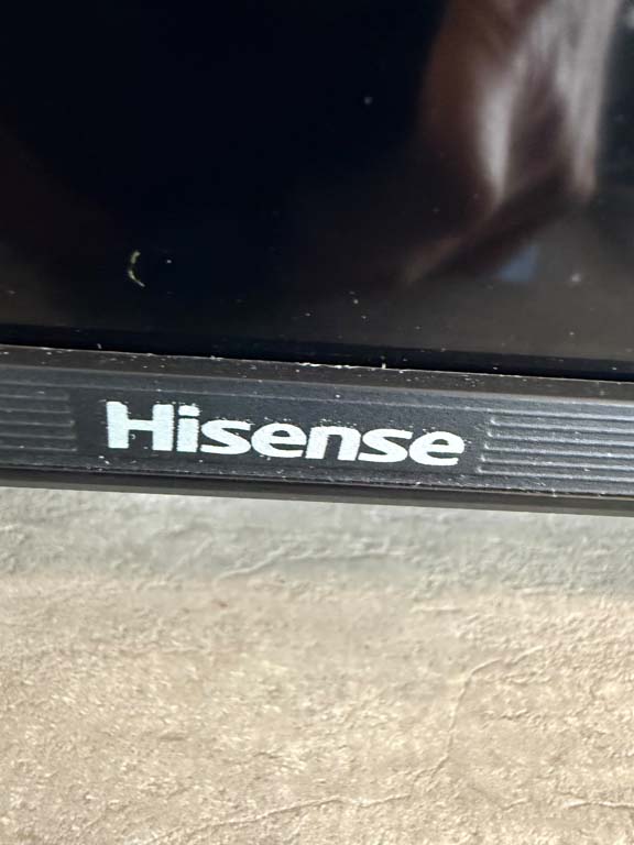 Two flat-screen TVs in abandoned household contents auction