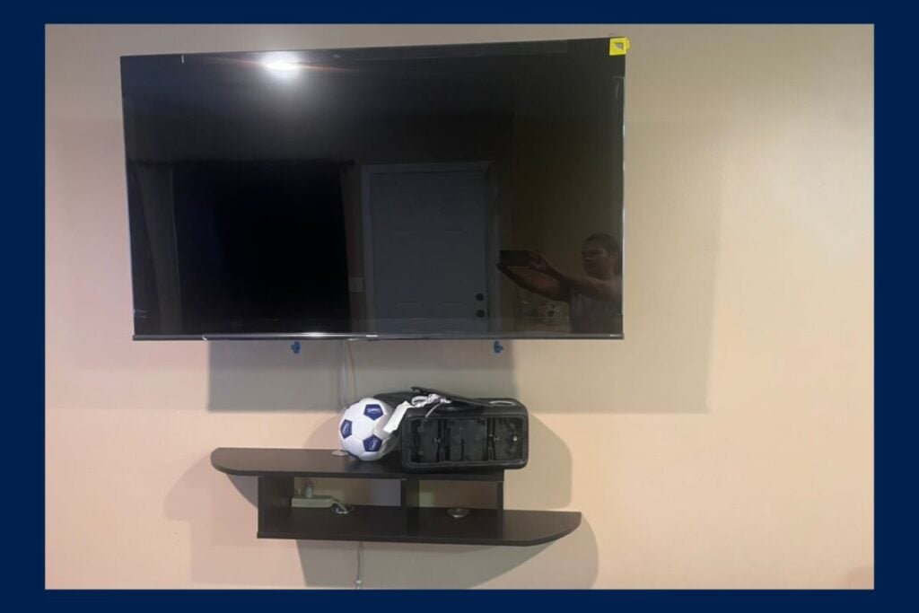 Two wall-mounted TVs at Sun Valley CA online auction